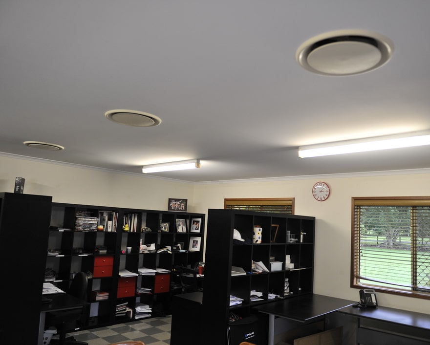 air conditioning ducts on the ceiling of a commercial office space