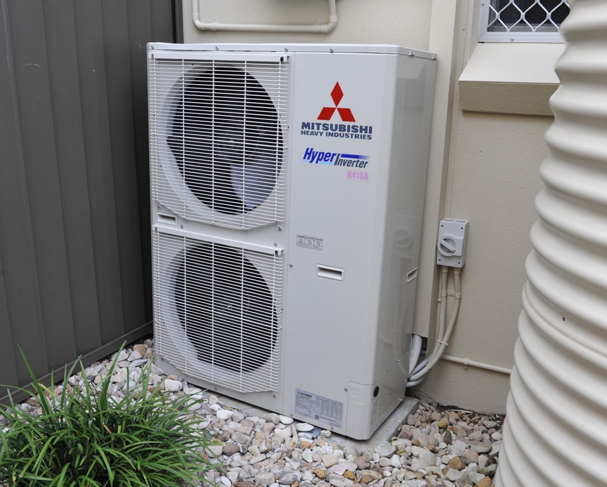 air conditioning unit standing outside a residence