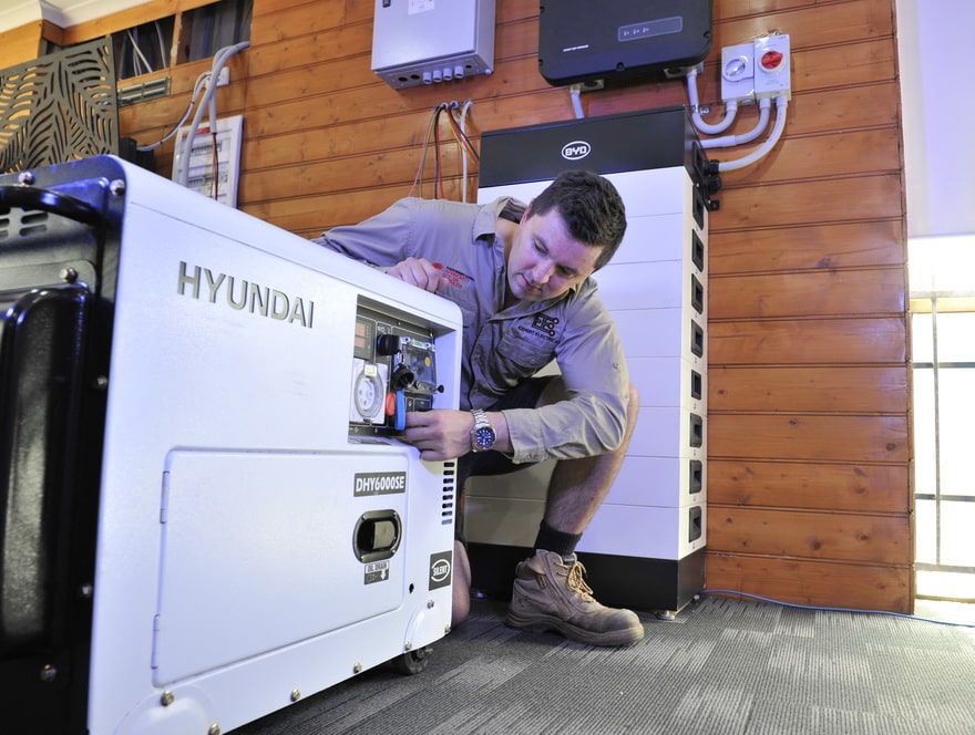expert electrical employee tinkering with a hyundai generator